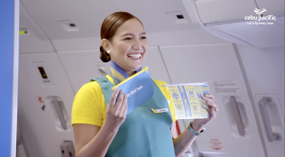 Cabin Crew member Cezzye Basa wears the Ramit scarf, symbolizing the meticulous care and continuity she brings to every flight. Service, she says, is like weaving—never rushed.