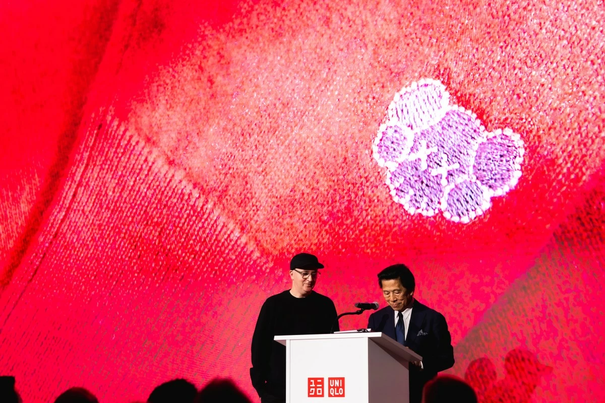 Kaws and John C. Jay (president of Global Creative, Fast Retailing)