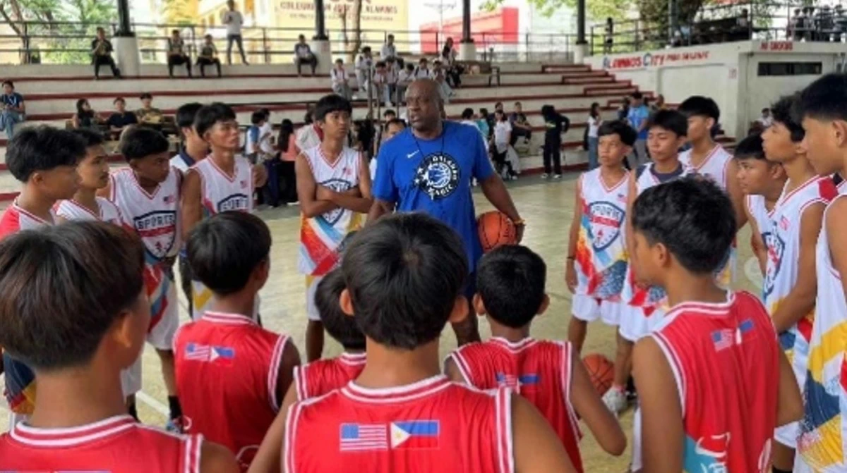 US Sports Envoy Taj McWilliams-Franklin joins participants after a basketball clinic in Alaminos City, Pangasinan