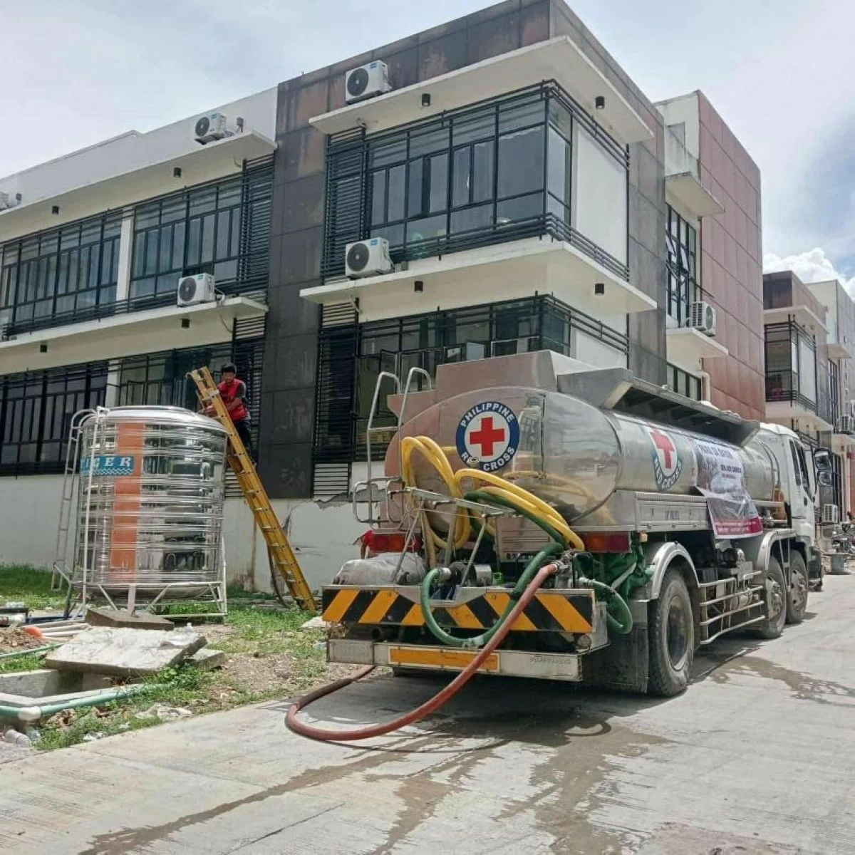 PRC teams distribute clean water and essential supplies to displaced residents a week after the Cebu earthquake. (Photo from PH Red Cross)