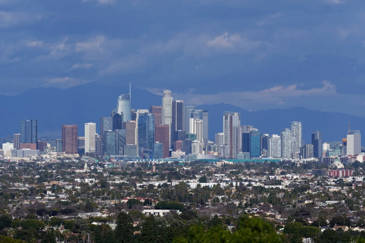 FILE - The Los Angeles skyline is seen from a Baldwin Hills overlook, Feb. 9, 2024. (AP Photo/Damian Dovarganes, File)