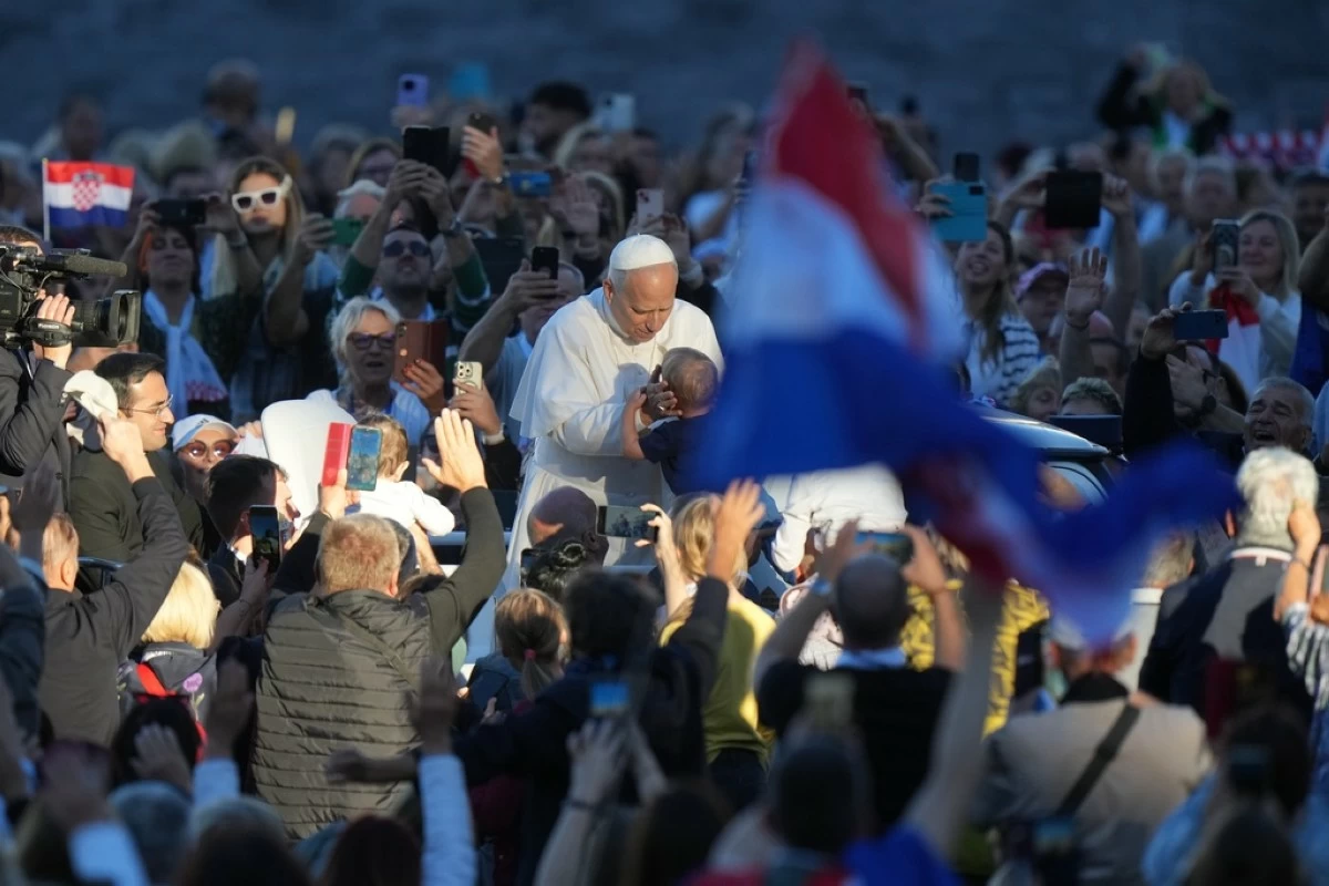 Pope Leo XIV greets pilgrims from Croatia in St. Peter's Square at the Vatican, Tuesday, Oct. 7, 2025. (AP Photo/Andrew Medichini)