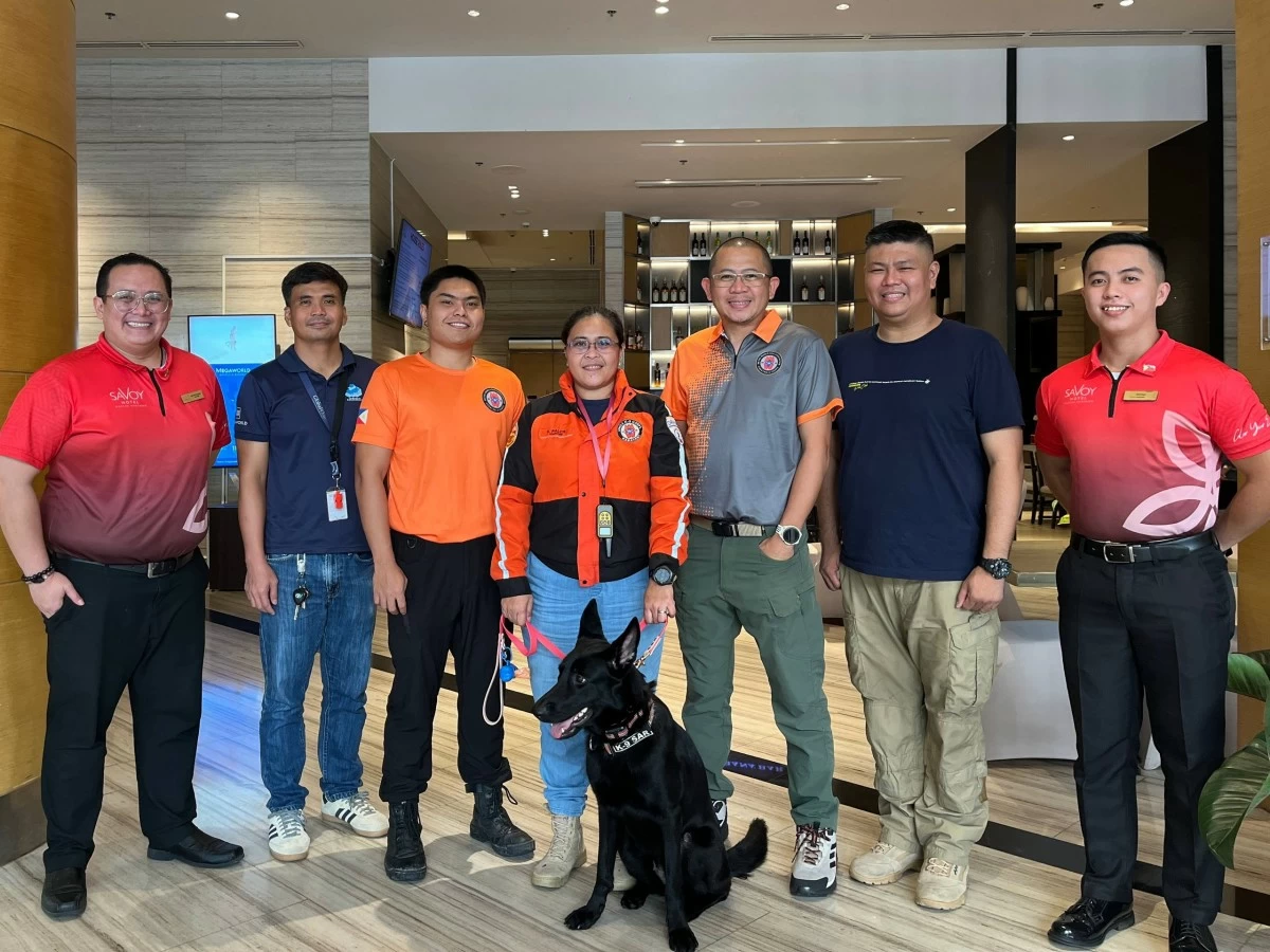 MMDA K-9 Corps back at Savoy Hotel Mactan Newtown following Bogo City rescue mission together with General Manager Josef Chiongbian, Associate Director for Safety and Security VisMin Lan Lago, and RAPID Ambulance Cebu President Rafael Enriquez.