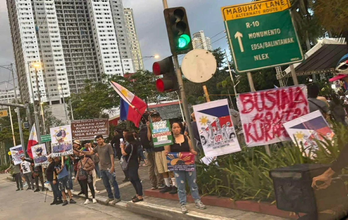 Rallyists carry placards during a protest at Plaza Rajah Sulayman in Malate, Manila, calling for government accountability and reforms. (Photo courtesy of Manila Bulletin)
