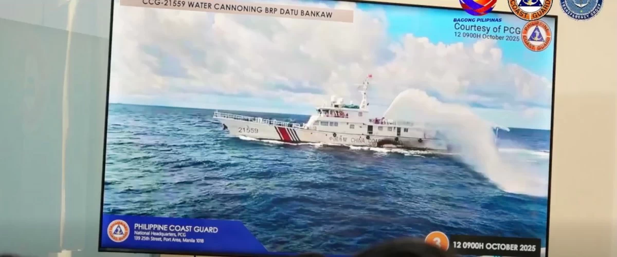 A China Coast Guard ship fires a water cannon at BRP Datu Bankaw while the latter is in Pag-asa Island, West Philippine Sea on Oct. 12, 2025 during a humanitarian mission. (Courtesy of Philippine Coast Guard)