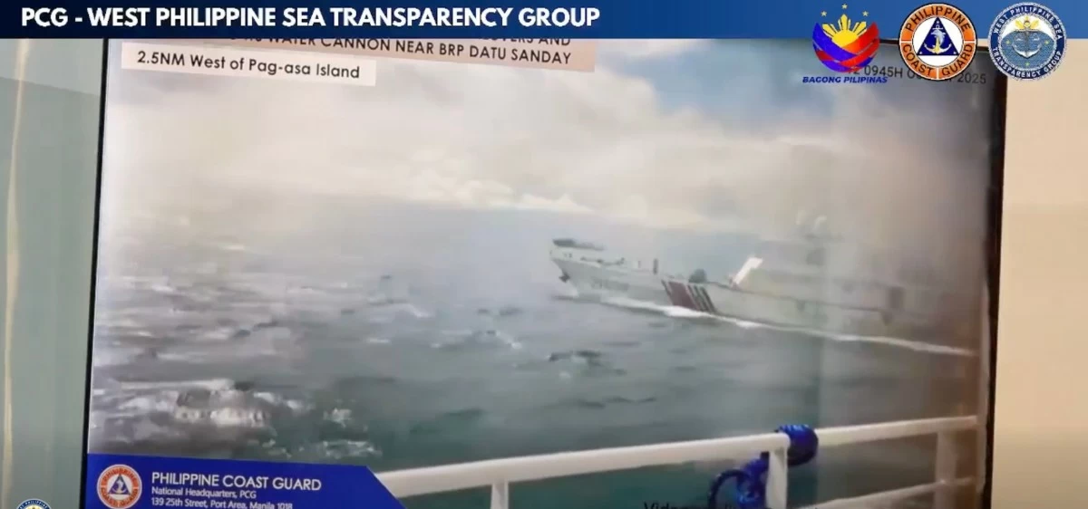 A China Coast Guard ship fires a water cannon at BRP Datu Sanday while the latter is in Pag-asa Island, West Philippine Sea on Oct. 12, 2025 during a humanitarian mission. (Courtesy of Philippine Coast Guard)