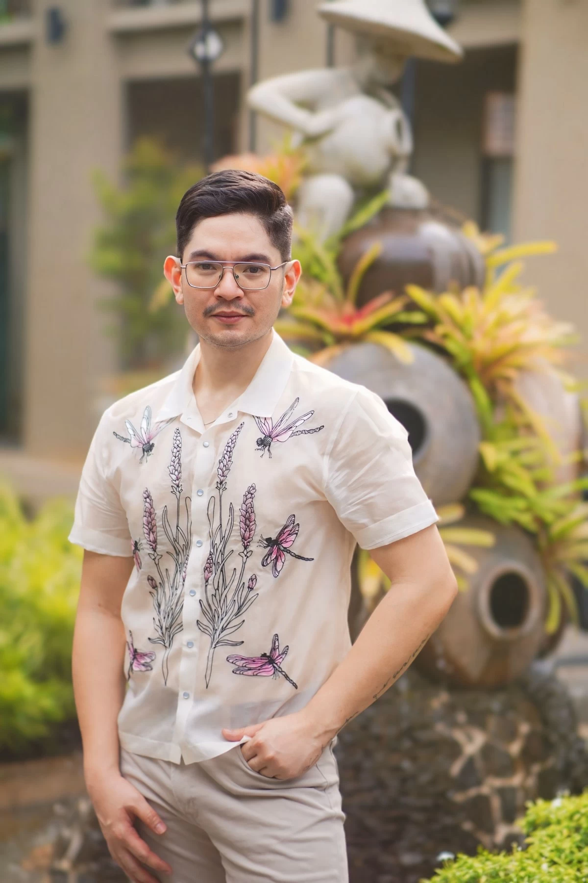 Dr. Lambert L. Angeles, the brainchild of La Luma, with the main centerpiece of the property in the background