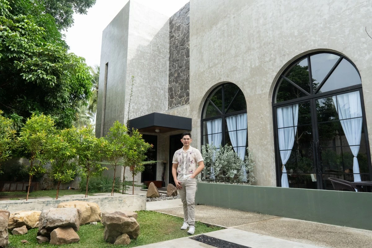 Dr. Lambert L. Angeles, the brainchild of La Luma, with the main centerpiece of the property in the background