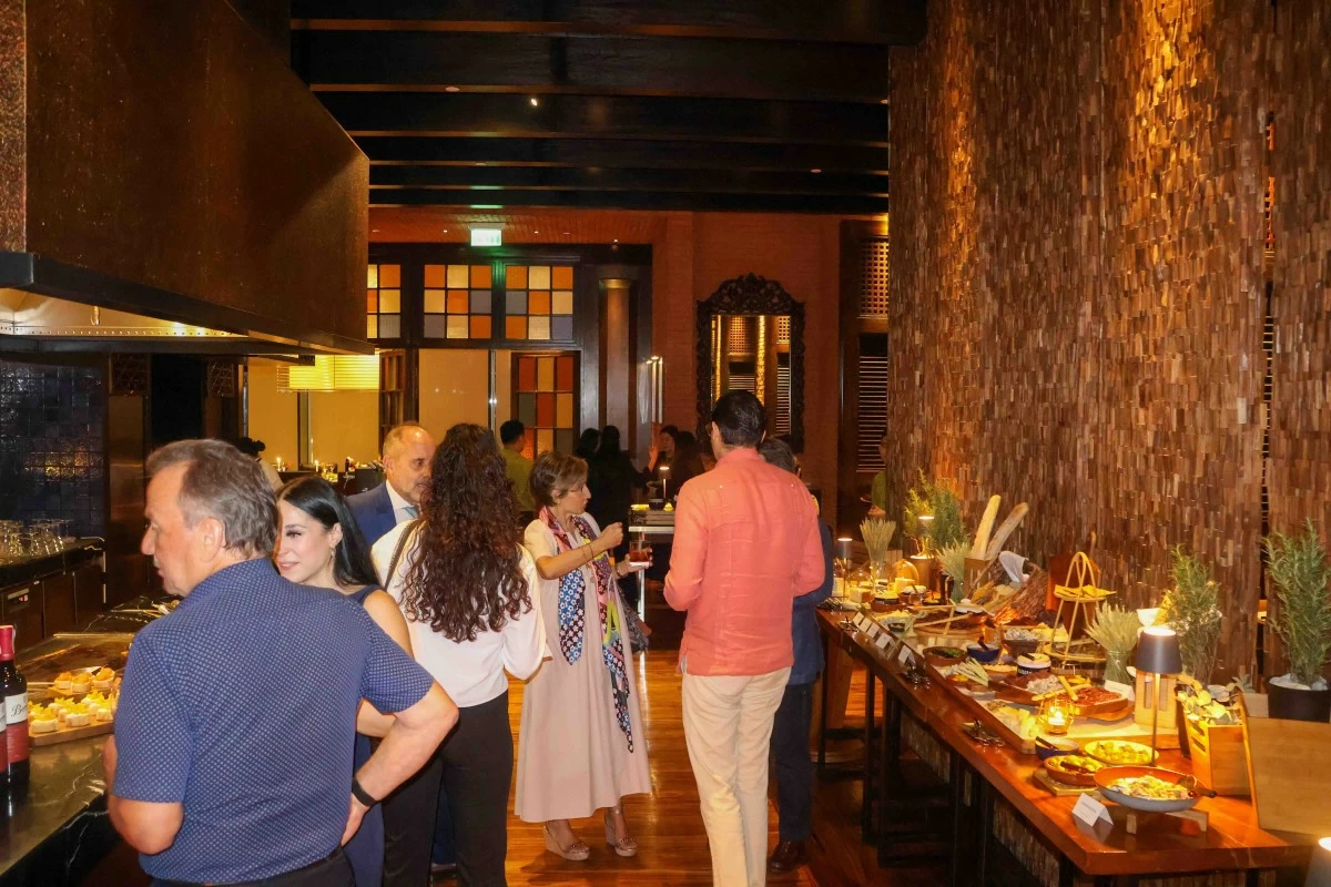 WARM WHISPERS The Cellar’s intimate interiors glow with rustic charm, where brick walls, wooden accents, and soft lighting create the perfect setting for lingering over wine and Spanish fare