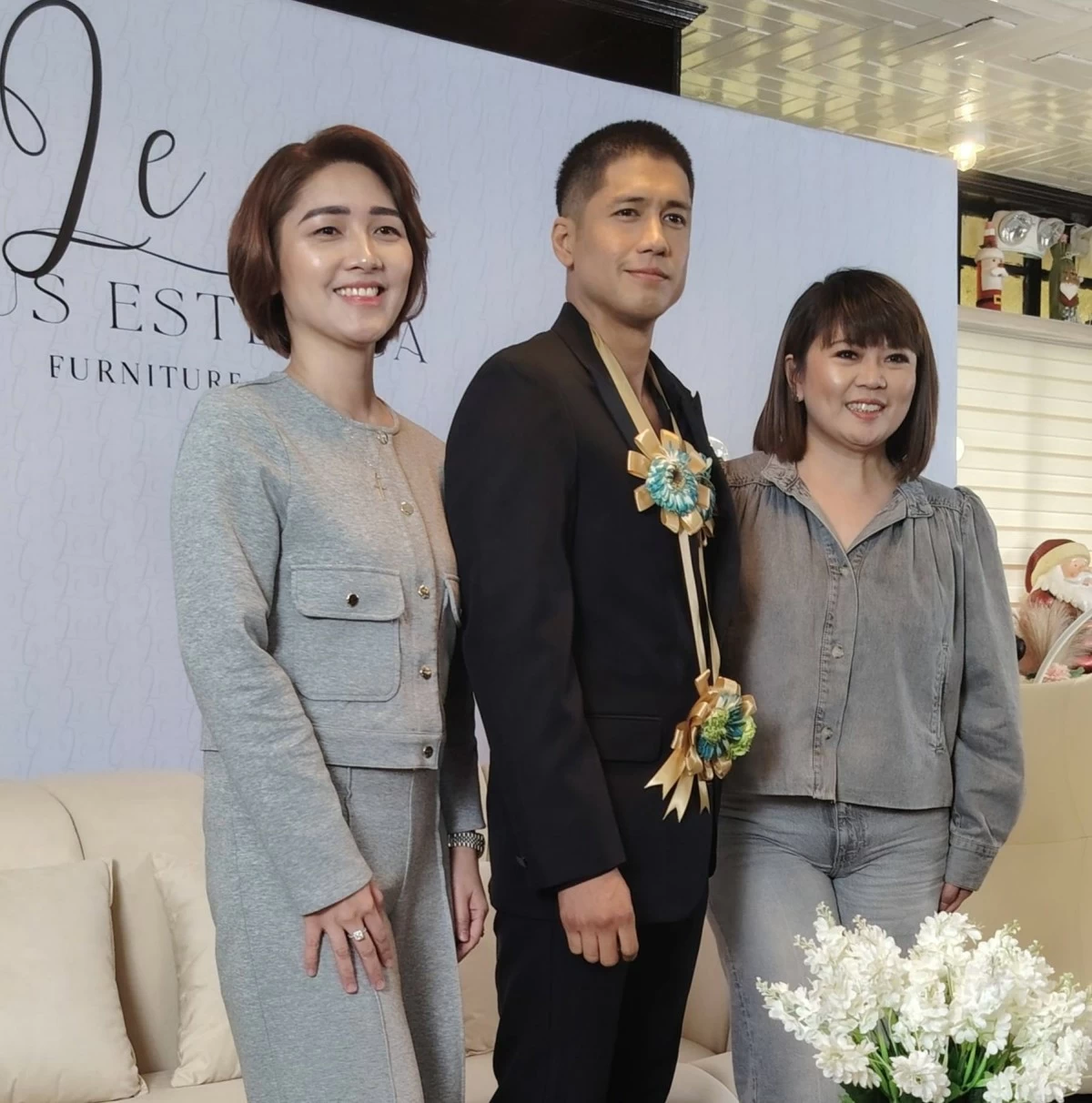 Aljur Abrenica (center) with Pauline Publico (left) and April Martin, of Luxus Estetica Furniture.