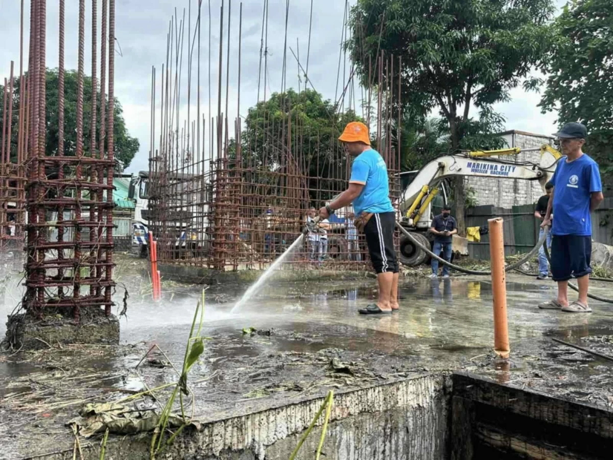 Personnel from the City Engineering Department conduct clearing operations to begin construction for the completion of the Super Health Center in Marikina City. (Contributed photos)