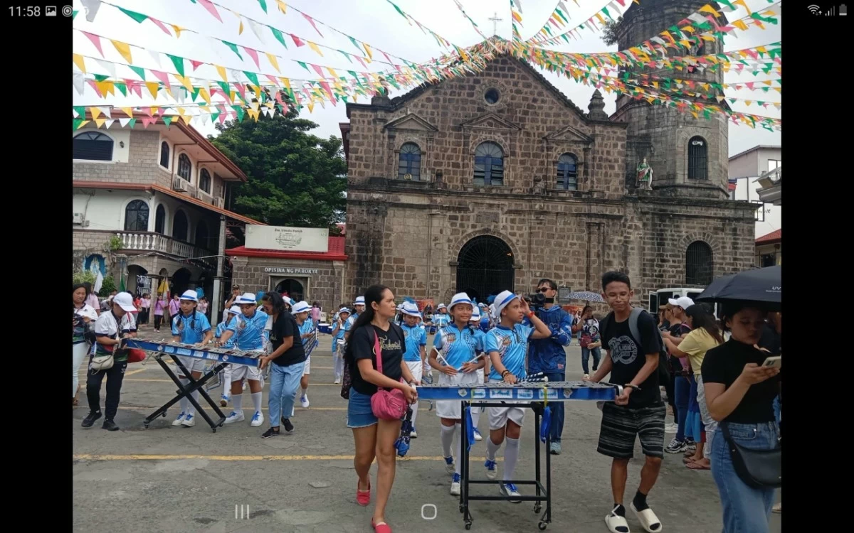 A drum and lyre group of students gathers outside the Saint Ursula Parish Church in Binangonan, Rizal during the street dance and parade on Oct. 18 (photo by Nel Andrade)