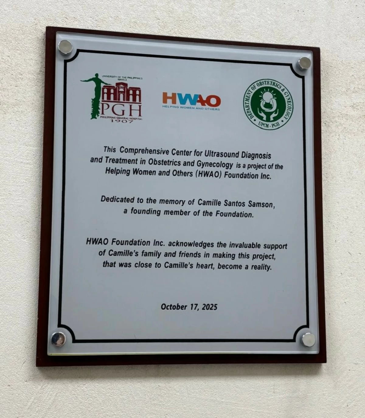 The plaque at the Center’s entrance