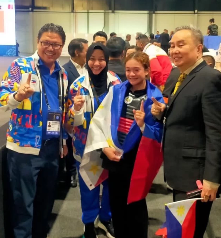 From left, Philippine's chief of mission to the Asian Youth Games Ramon "Tats Suzara, Pencak Silat NSA head Princess Kiram, Kram Airam Carpio and Philippine Olympic Committee president Abraham "Bambol" Tolentino. (POC Photo)