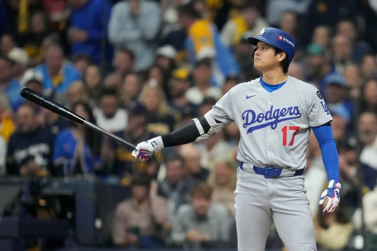 Los Angeles Dodgers' Shohei Ohtani waits to bat against the Milwaukee Brewers during the first inning in Game 2 of baseball's National League Championship Series, Tuesday, Oct. 14, 2025, in Milwaukee. (AP Photo/Ashley Landis)