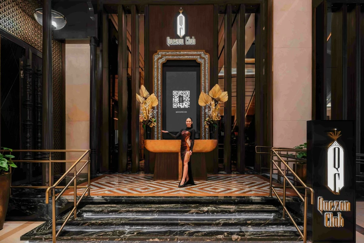 GOLDEN GATE The Art Deco–inspired entrance of Quezon Club at Solaire Resort North, illuminated in warm gold tones and intricate detailing.