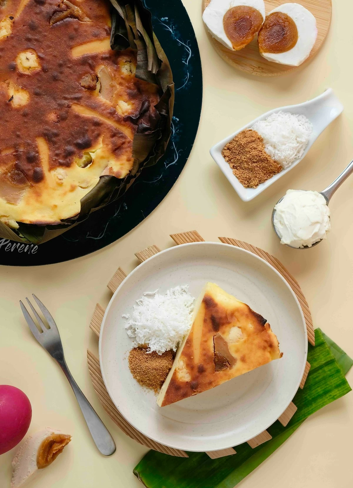 CHRISTMAS COMFORT The Bibingka Burnt Cheesecake, baked in banana leaves and topped with cheese, salted egg, and coconut, tastes like Christmas mornings in every bite.
