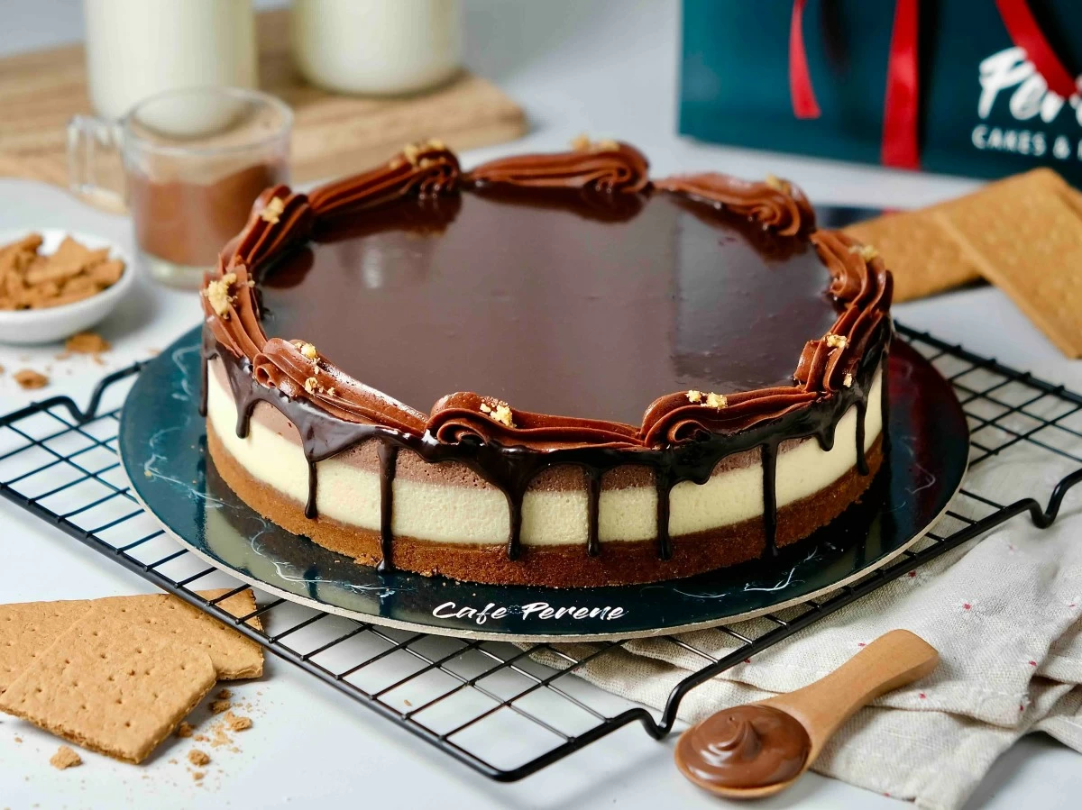HAZELNUT INDULGENCE Perene’s Nutella Cheesecake layers rich chocolate-hazelnut goodness with a creamy cheesecake base—still a best-seller since 2015.