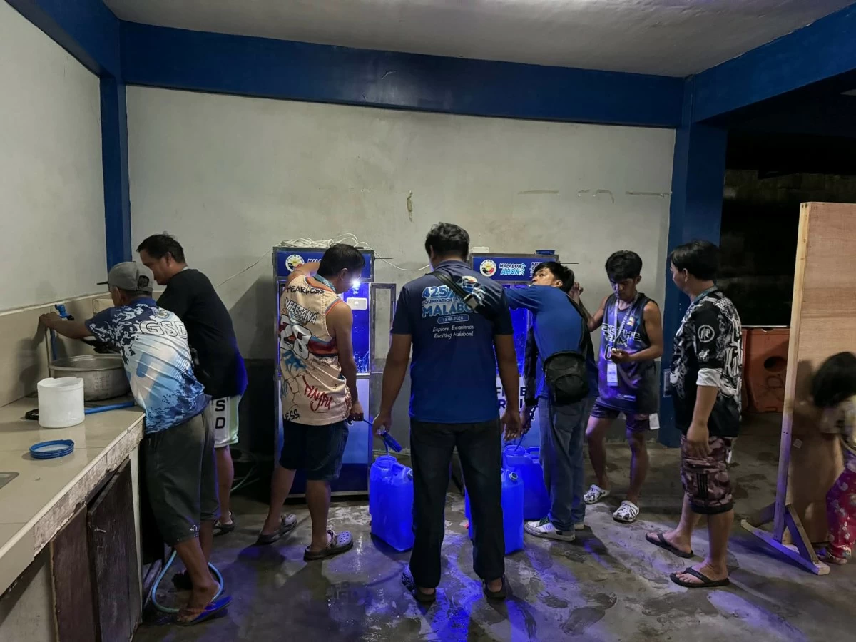 Residences refill their gallons for purified drinking water (Photo from Malabon LGU)