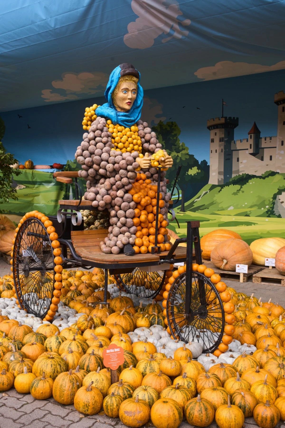 A pumpkin sculpture depicting Bertha Benz, the famous German automotive pioneer, is displayed at Klaistow farm’s annual pumpkin festival, which this year celebrates “powerful women,” in Beelitz near Berlin, Germany, Tuesday, Oct. 21, 2025. (AP Photo/Markus Schreiber)