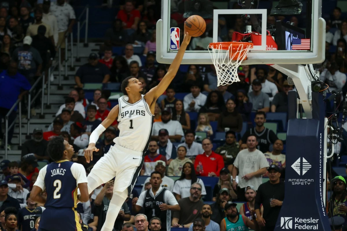 San Antonio Spurs forward Victor Wembanyama (1) shoots a layup during the first half of an NBA basketball game Friday, Oct. 24, 2025, in New Orleans. (AP Photo/Peter Forest)