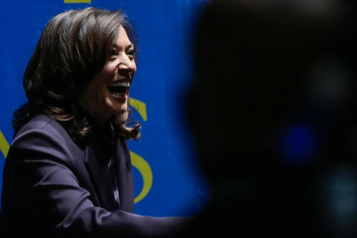 Former Vice President Kamala Harris greets people before she speaks, Friday, Oct. 17, 2025, in Birmingham, Ala. (AP Photo/Mike Stewart)