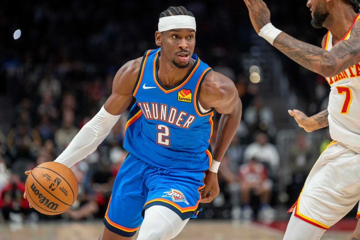 Oklahoma City Thunder guard Shai Gilgeous-Alexander (2) drives the ball down court during the first half of an NBA basketball game against the Atlanta Hawks, Saturday, Oct. 25, 2025, in Atlanta. (AP Photo/Erik Rank)