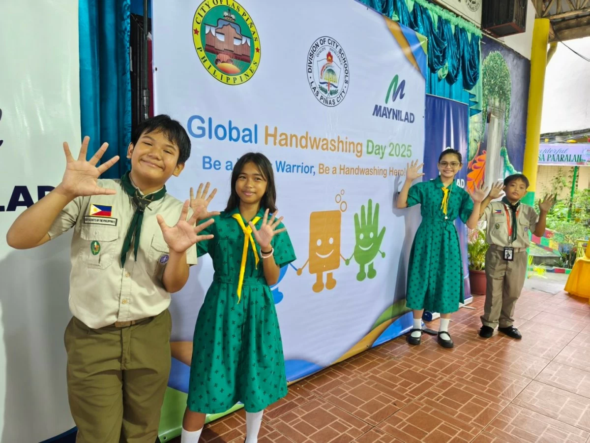 Boy and Girl Scouts of Pamplona Elementary School Unit 1 proudly show their clean hands after participating in Maynilad’s Global Handwashing Day activities. 
