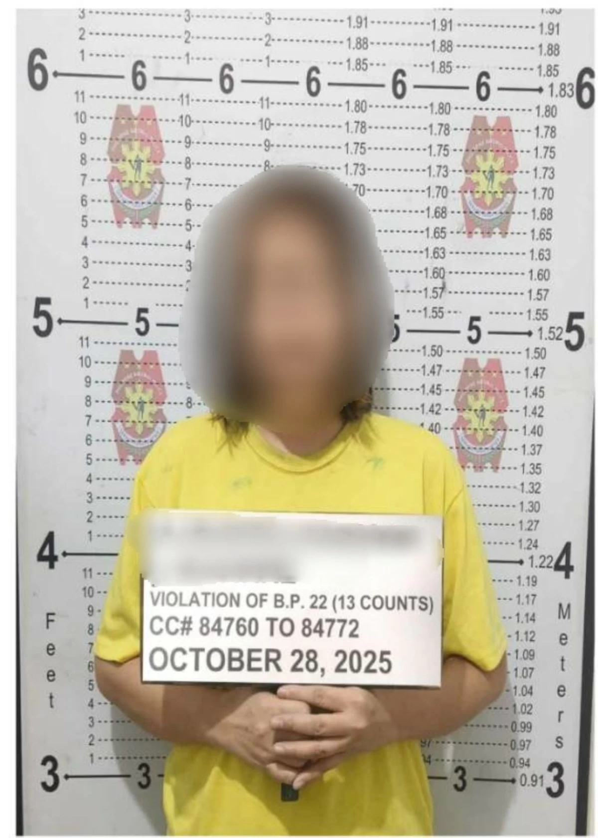 The arrested suspect for 13 counts of bouncing checks (Photo from Parañaque City Police)
