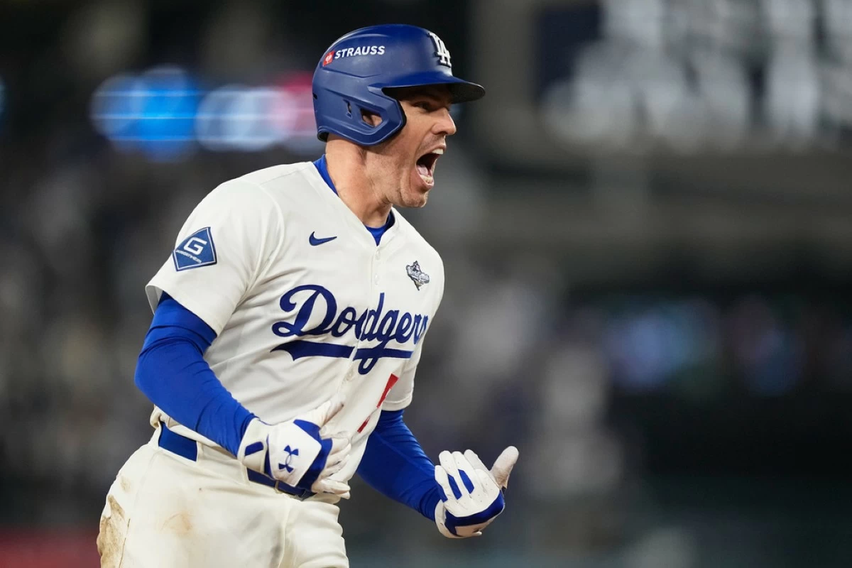 Los Angeles Dodgers' Freddie Freeman celebrates his walk off home run against the Toronto Blue Jays during the 18th inning in Game 3 of baseball's World Series, Monday, Oct. 27, 2025, in Los Angeles.(AP Photo/Brynn Anderson)