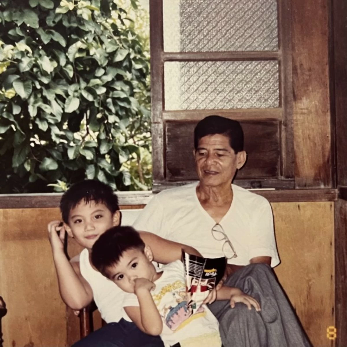 OLD HOME The author with his grandfather Osvaldo Custodio and younger cousin Charles Cruz inside the Custodio ancestral house on Zavalla Street in Sta. Rosa, Laguna.