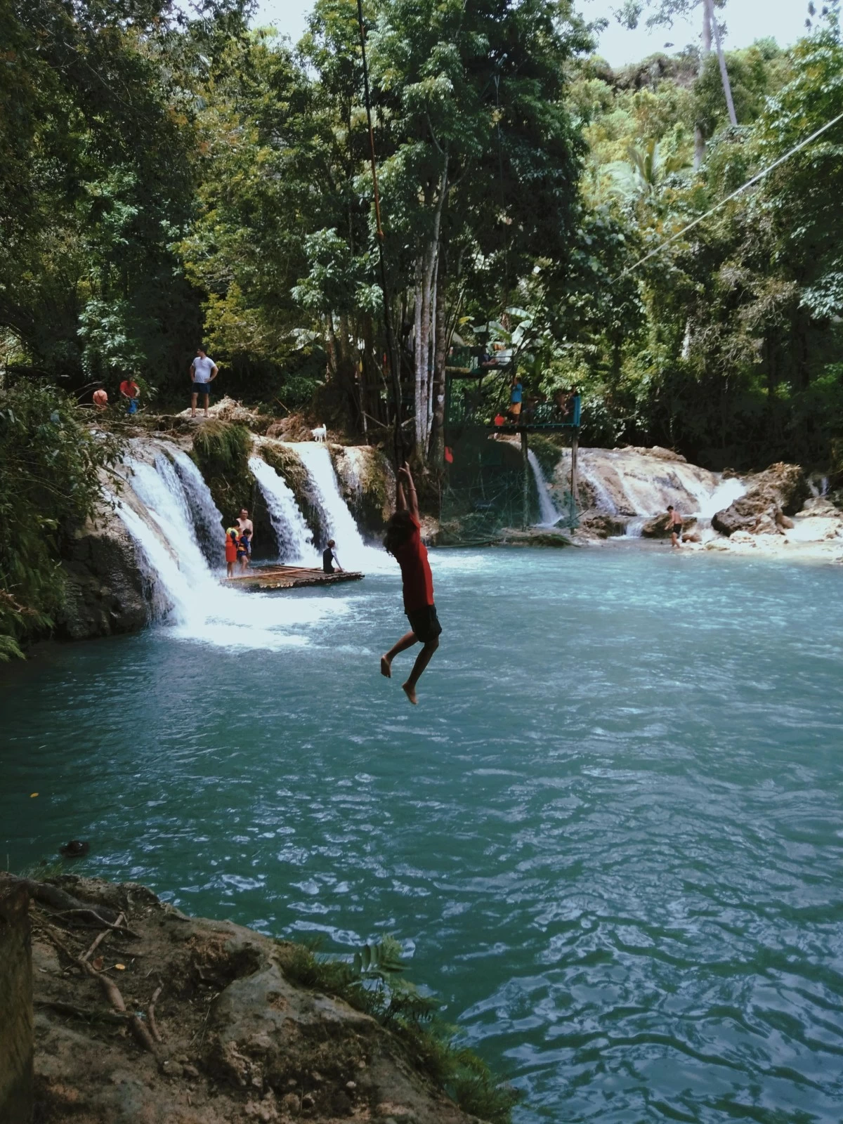 TAKE A DIP Many travelers enjoy the pristine waters found throughout Siquijor.