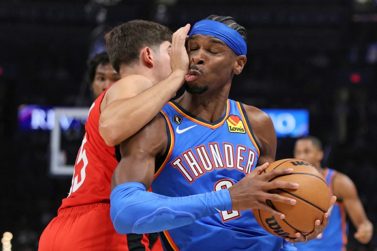 Oklahoma City Thunder guard Shai Gilgeous-Alexander, right, collides with Houston Rockets guard Reed Sheppard during the first half of an NBA basketball game Tuesday, Oct. 21, 2025, in Oklahoma City. (AP Photo/Nate Billings)