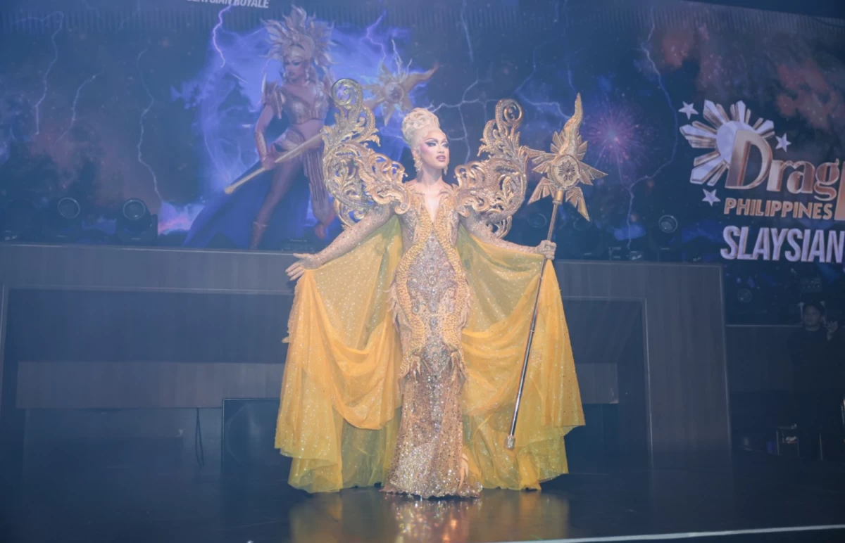 Brigiding graces the watch party stage wearing a beaded golden gown inspired by her entrance look from the season.