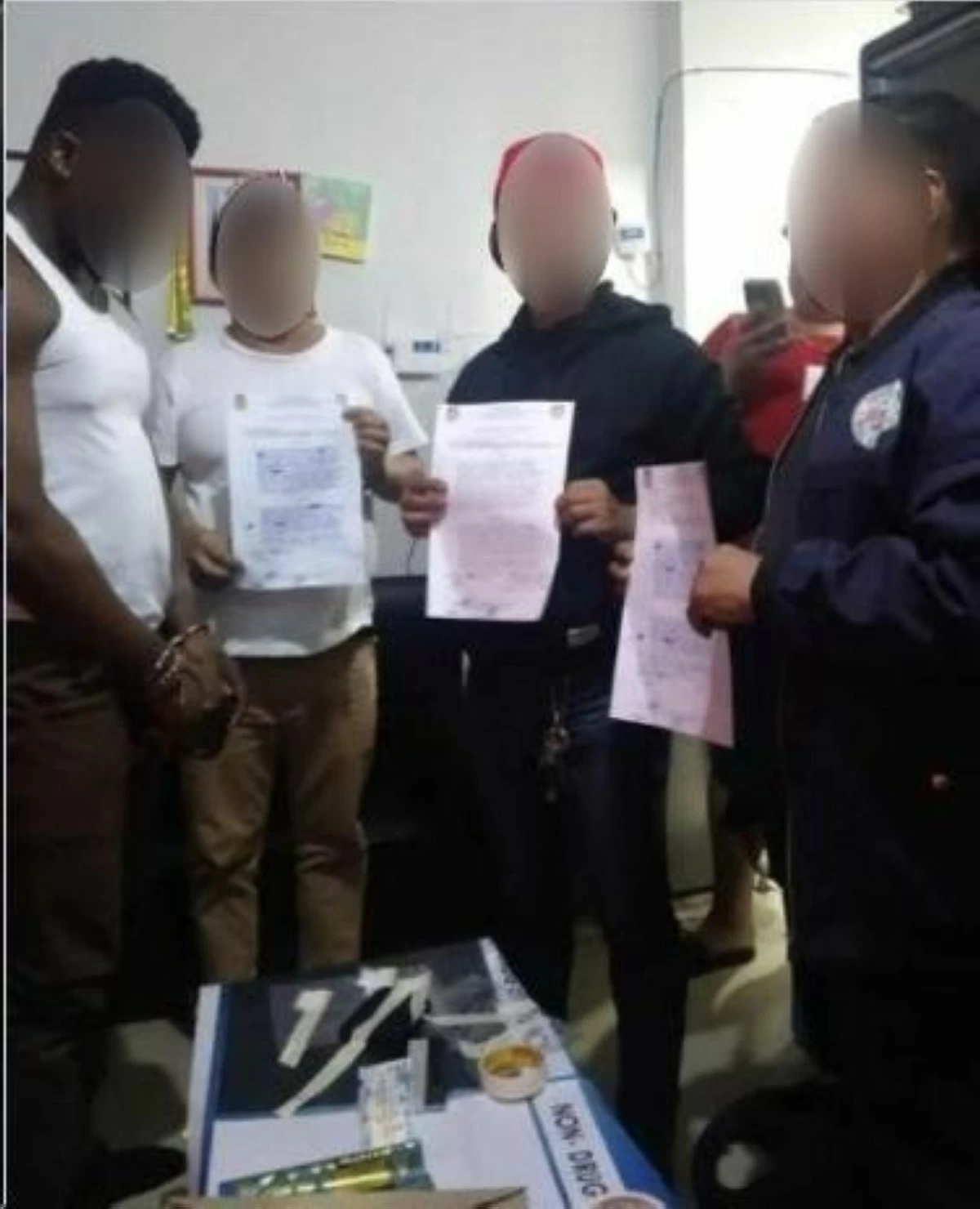 The arrested Nigerian national (in white sando) nabbed for possession of shabu (Photo from Parañaque City Police)