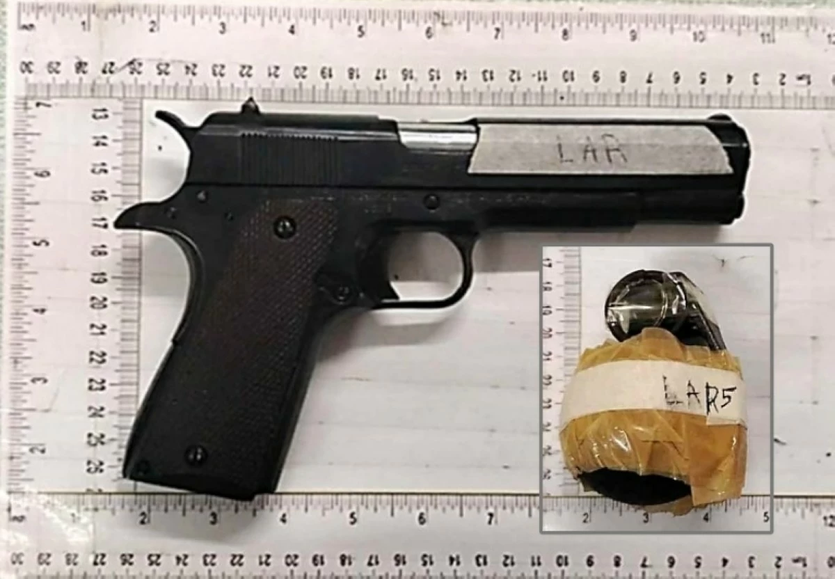 The gun and hand grenade seized from the suspect in Taguig (Photo from Taguig police / SPD) 