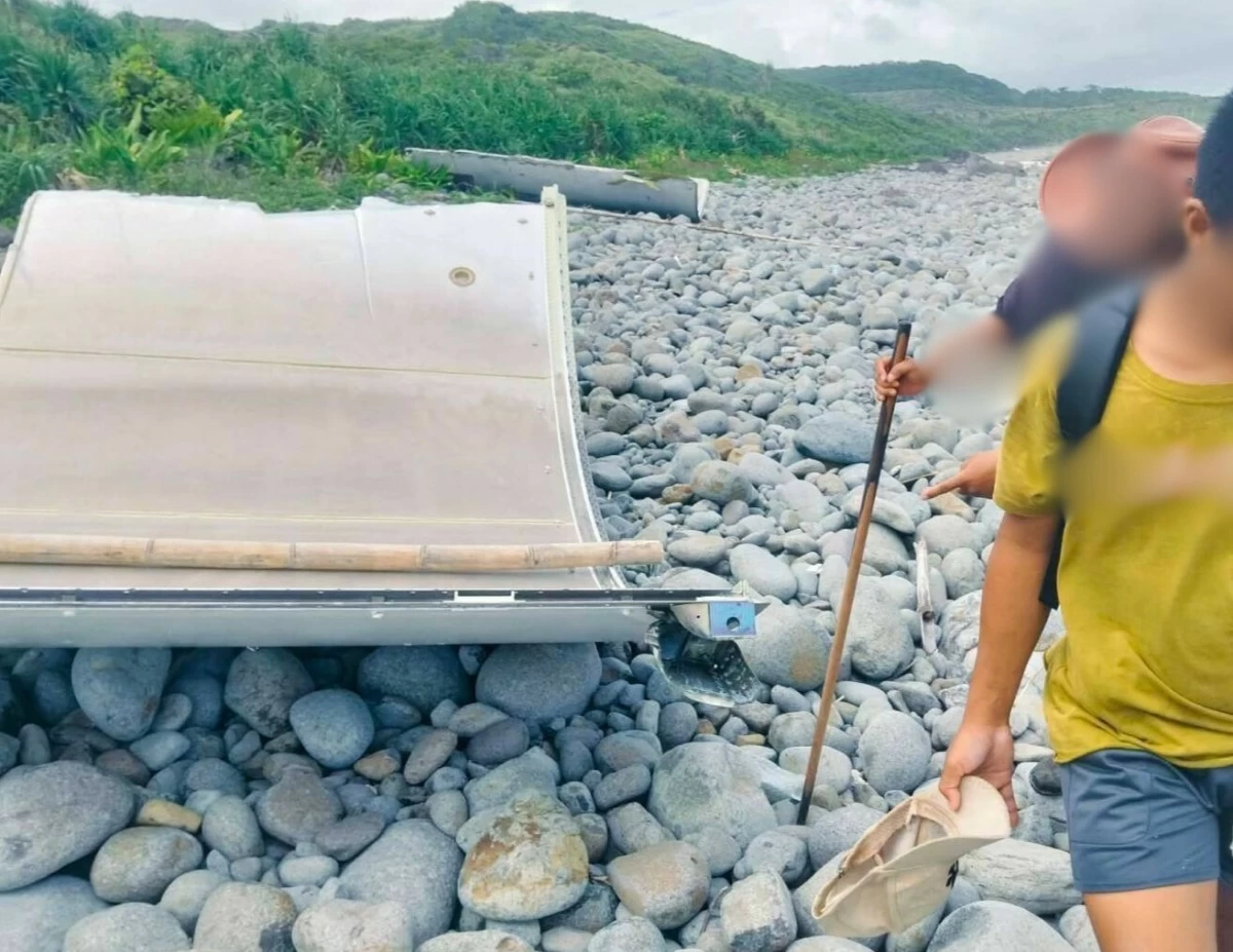 A suspected Chinese rocket debris is found by a group of trekkers along the shoreline of Camiguin Island in Calayan, Cagayan on Nov. 2, 2025. (Photo: Philippine Coast Guard)