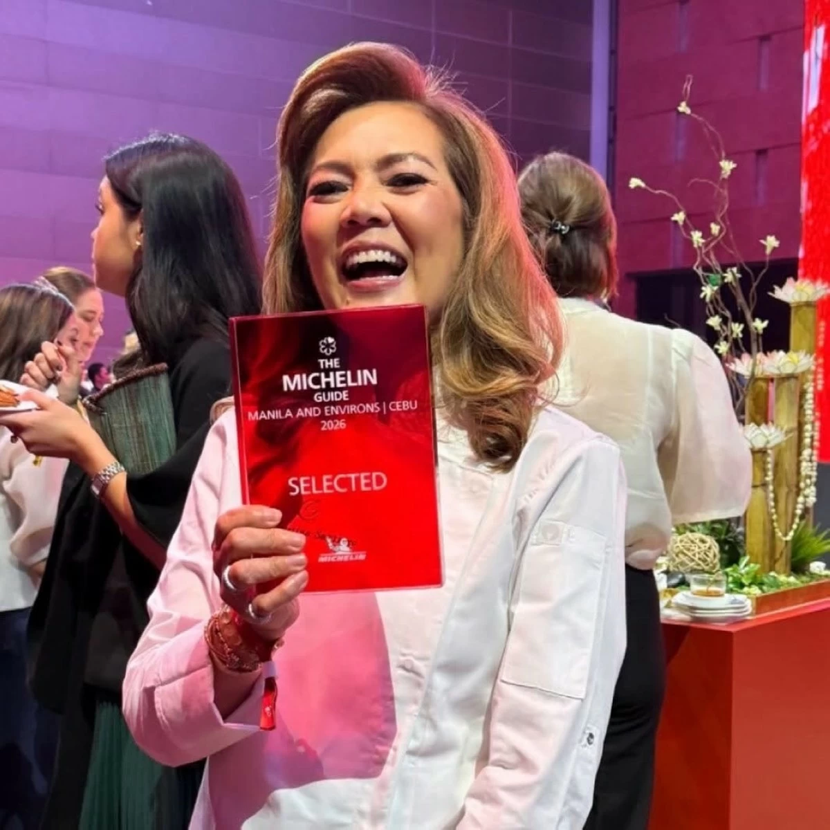 PURE JOY Chef Cristina Santiago of Carmelo’s Steakhouse beams as she holds her Michelin Selected trophy