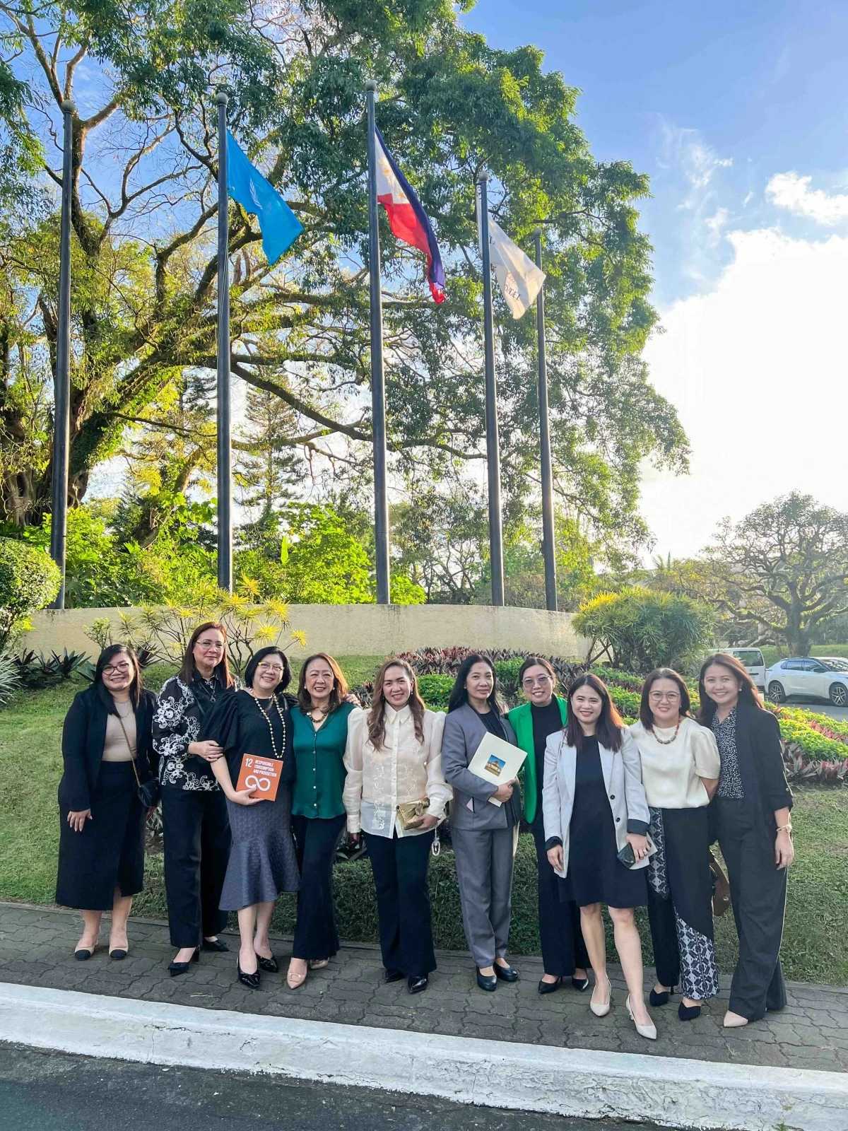 SM Hotels and Conventions Corporation (SMHCC) executives with the Taal Vista Hotel team during the UN flag-raising ceremony