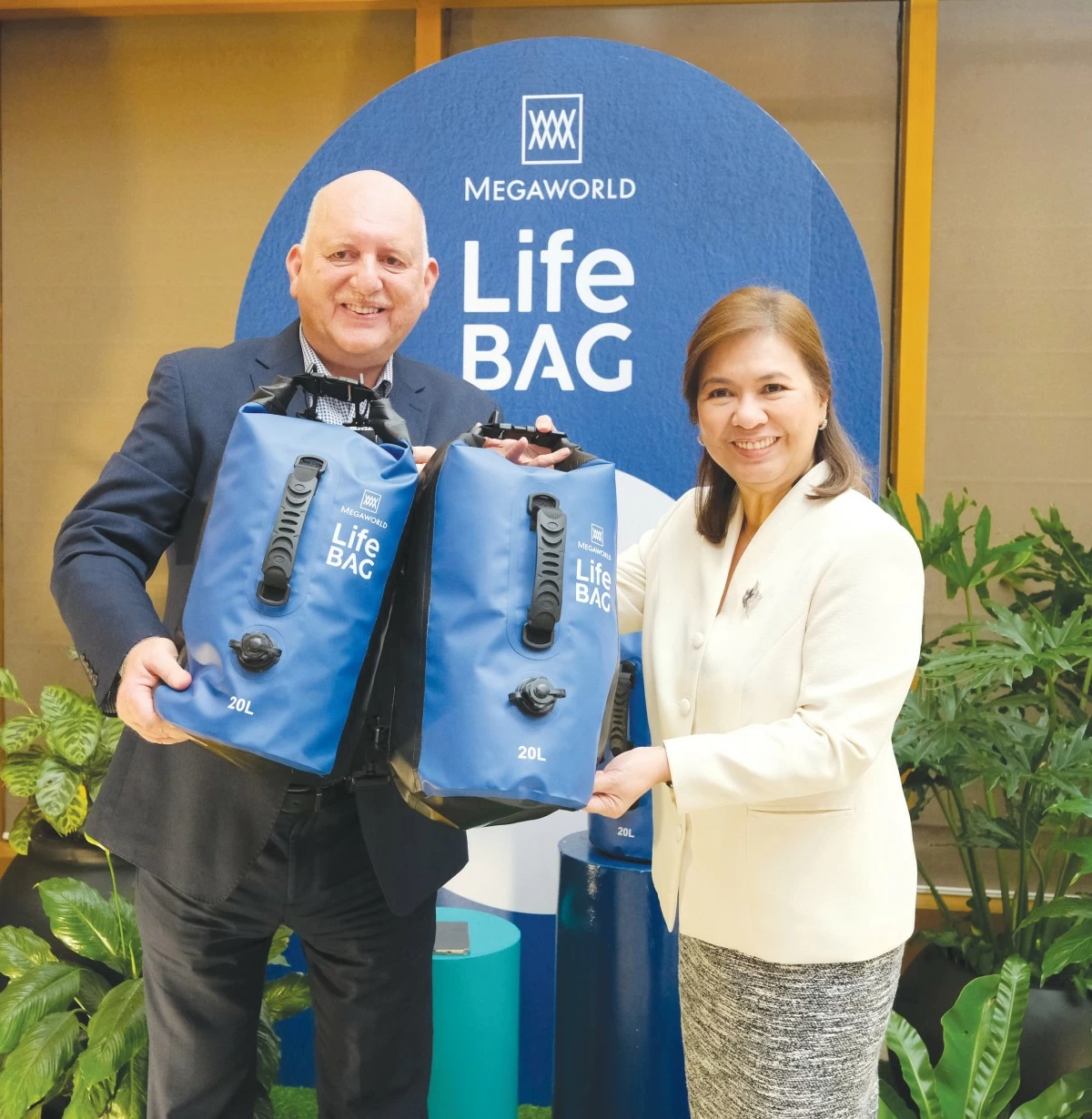 Megaworld’s Lourdes Gutierrez-Alfonso (right) and Megaworld Lifestyle Malls head Graham Coates highlight the creativity and ingenuity behind the Megaworld Life Bags that will soon be distributed to employees.

