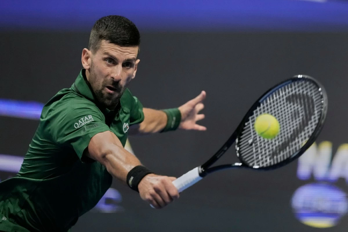 Novak Djokovic of Serbia plays a shot against Alejandro Tabilo of Chile during the ATP tournament round of 16 tennis match, in Athens, Greece, Tuesday, Nov. 4, 2025. (AP Photo/Petros Giannakouris)