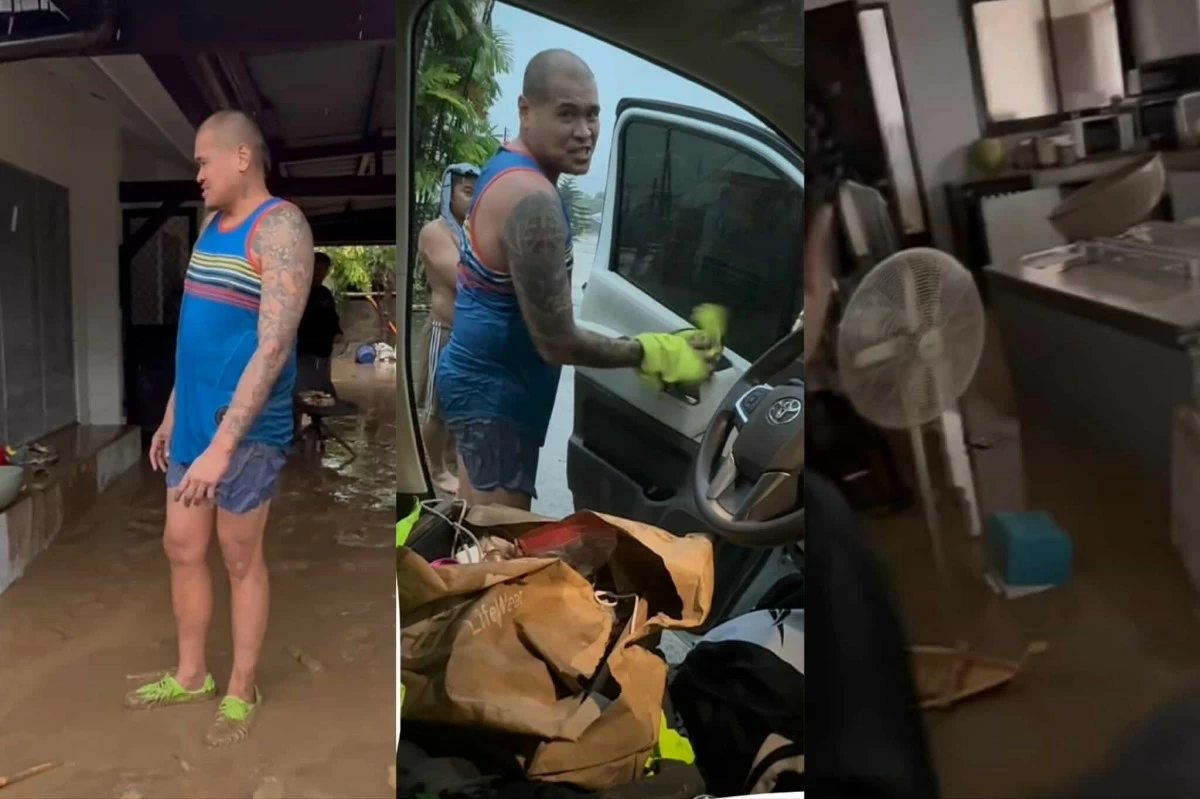 JR Quinahan looks on to his  family's belongings covered in mud. MA RY Facebook post