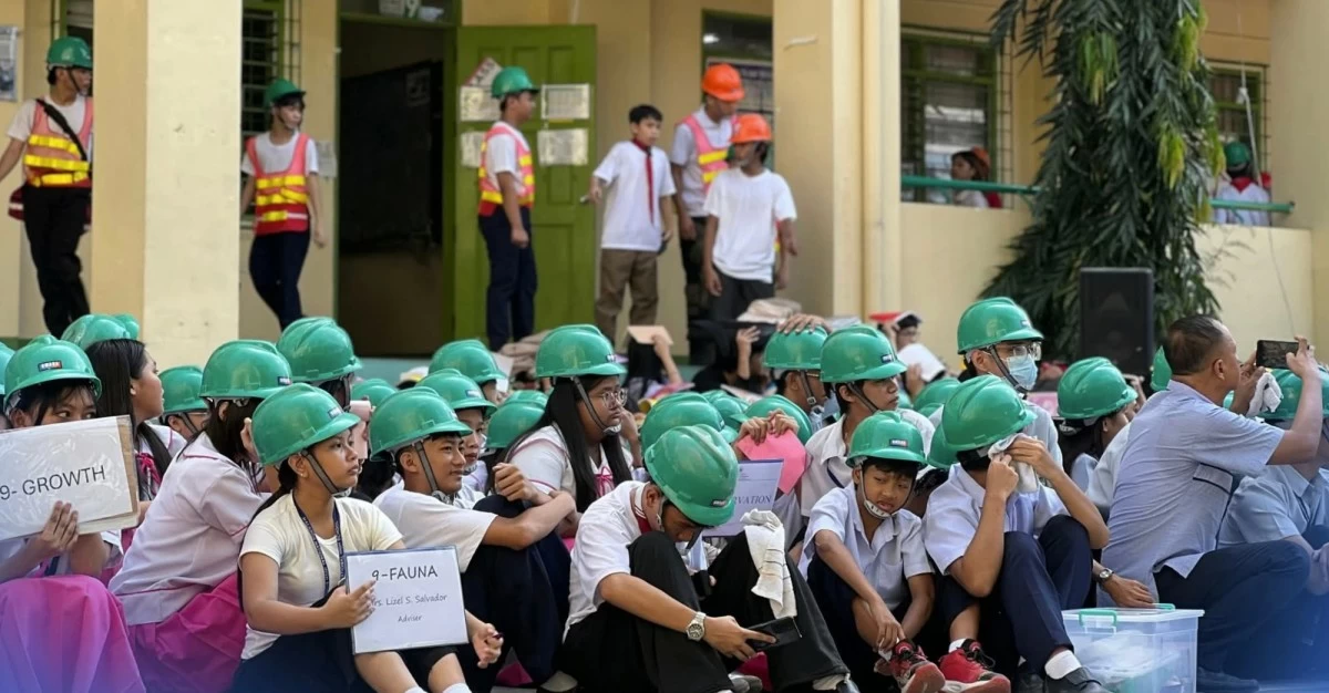 Students wear hard hats for protection during the Nationwide Simultaneous Earthquake Drill on Thursday, November 6. (Photo from MNHS)