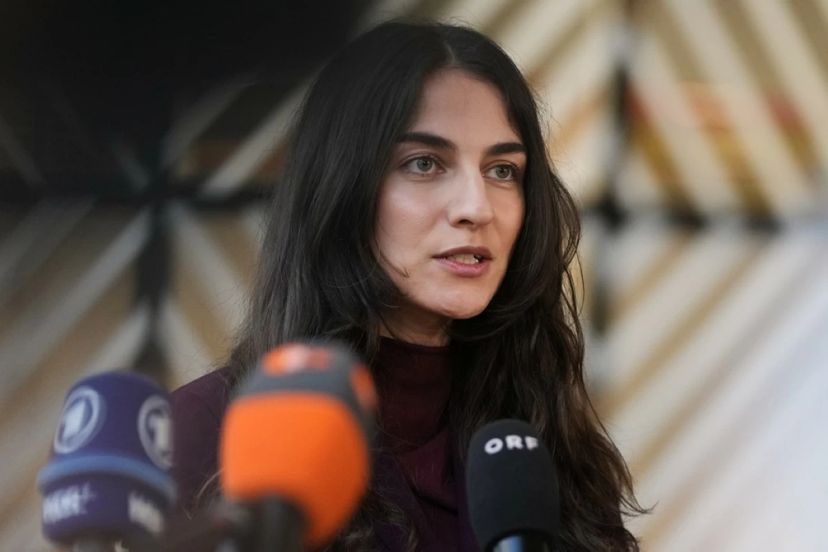Sweden's Environment Minister Romina Pourmokhtari speaks with the media as she arrives for a meeting of EU Environment ministers at the European Council building in Brussels, Belgium, Tuesday, Nov. 4, 2025. (AP Photo/Virginia Mayo)