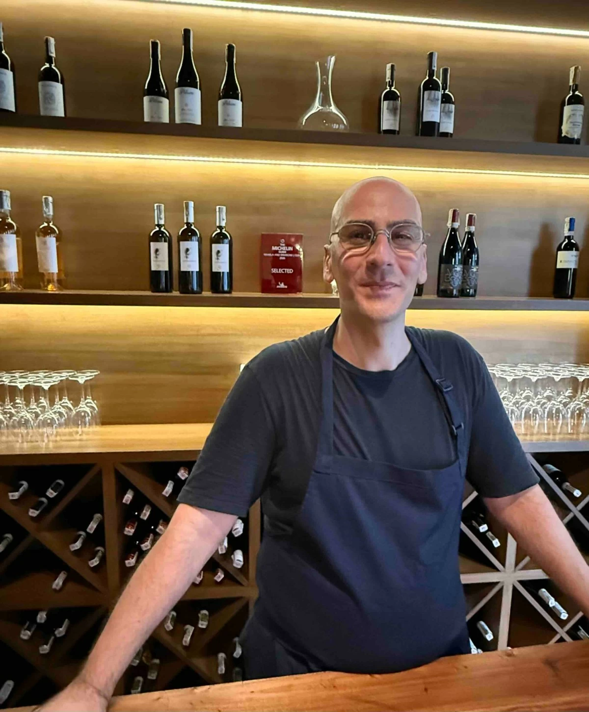 Chef Francesco D’Arrigo with the Michelin Selected plaque behind him