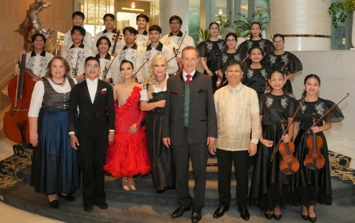 Ambassador Johann Brieger, with his spouse Mme. Roswitha Brieger and Consul Margit Loidolt, poses with the Manila Symphony Junior Orchestra and Philippine National Dancesport athletes Von Elijah Z. Lavado and Allyssa L. Dator.