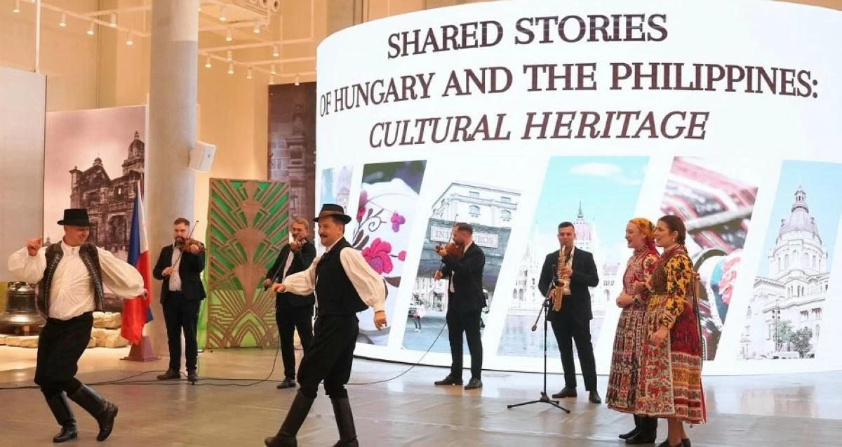 The Flaska Band joined by Hungarian folk dancers in traditional attire.
