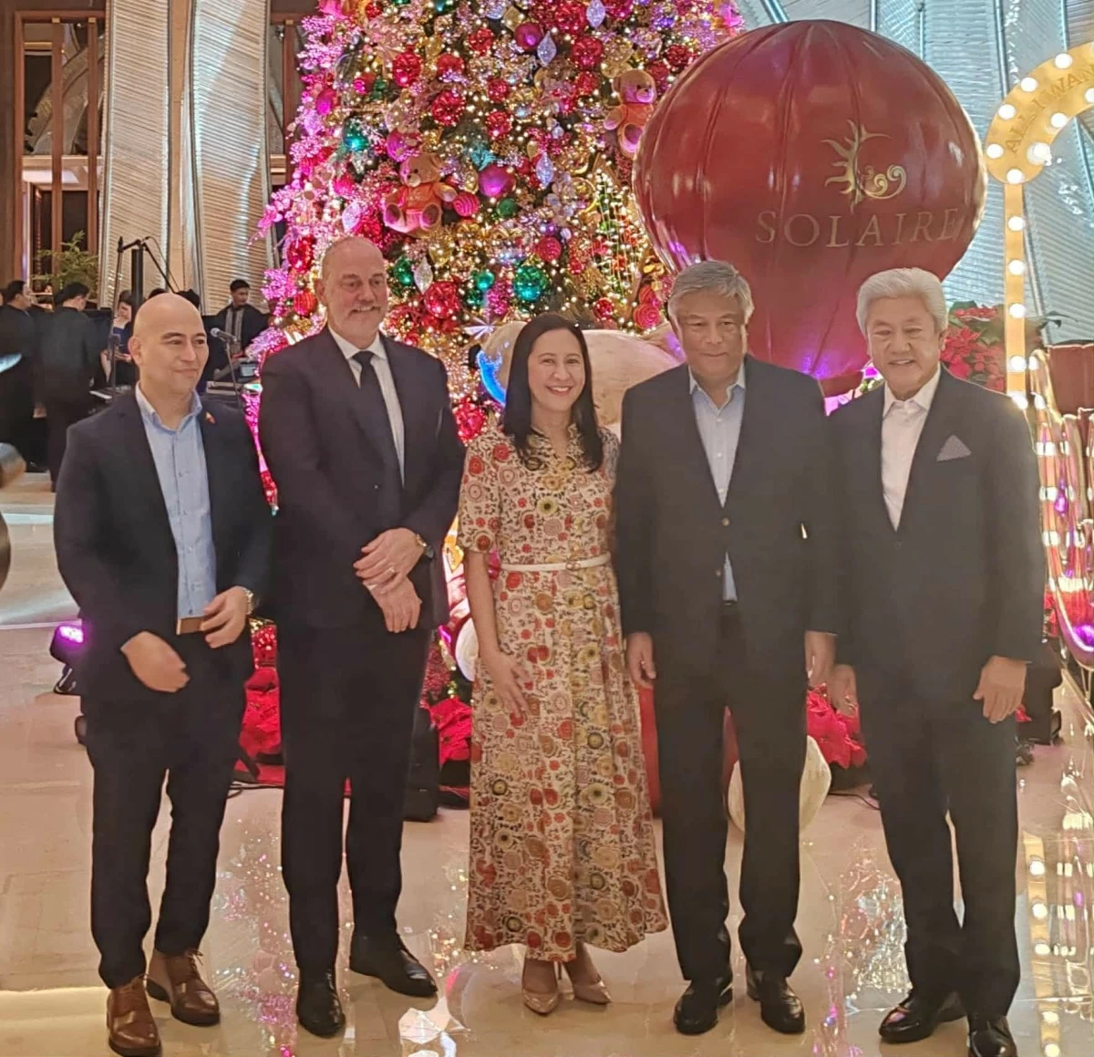 Solaire Resort North Chief Operating Officer Damian Quayle and Quezon City Mayor Joy Belmonte lead the Christmas lighting event with PAGCOR Chairman and CEO Alejandro Tengco, Department of Tourism–NCR Assistant Regional Director Ivan Agote, and Bloomberry Resorts Corporation Vice Chairman for Construction and Regulatory Affairs Donato Almeda