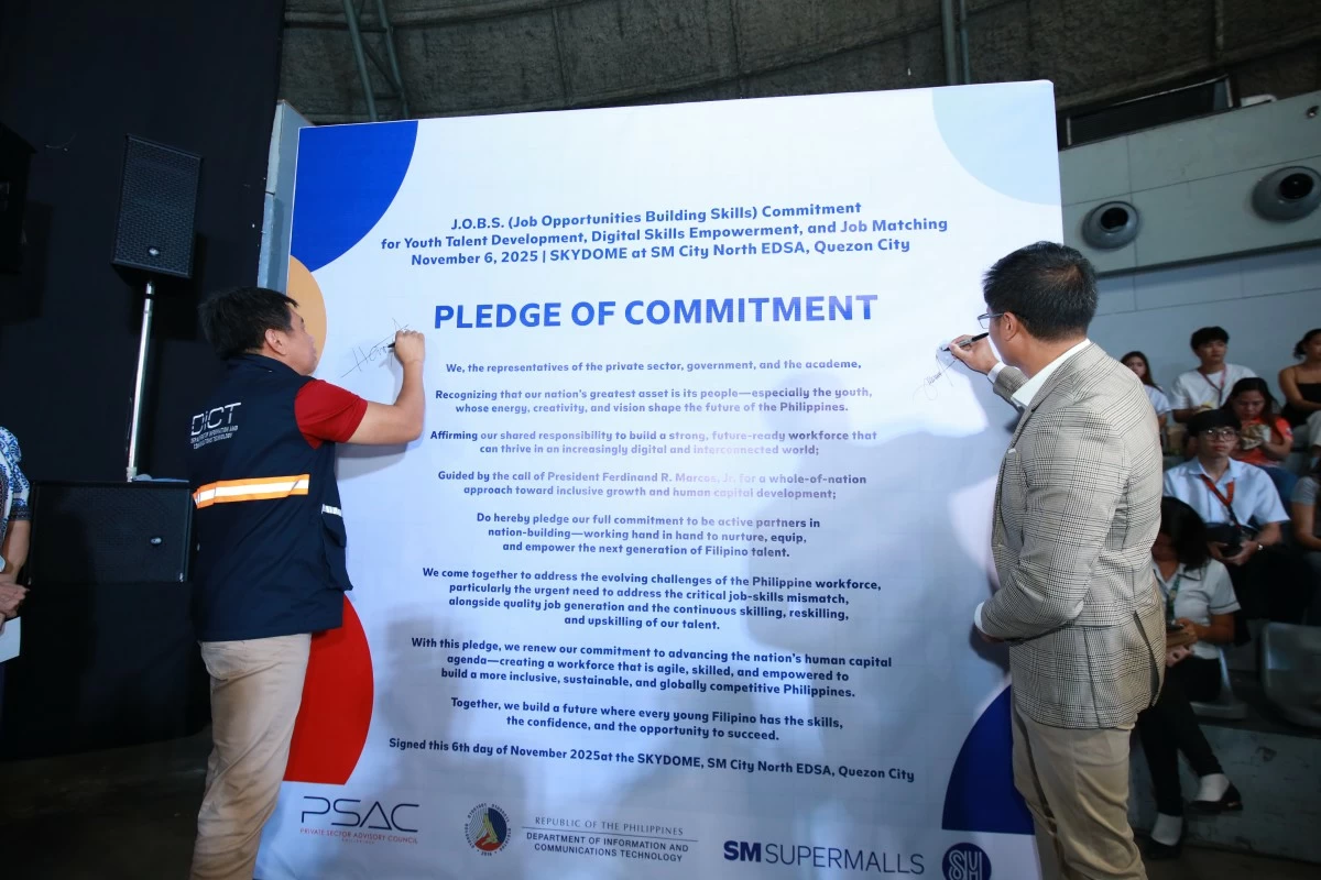 Department of Information and Communications Technology (DICT) Secretary Henry Aguda and SM Supermalls VP for Mall Operations Junias Eusebio formalize their partnership through a memorandum of understanding (MOU) to establish digital corners in SM Job Fairs. The two leaders also reaffirm their shared commitment through the Pledge of Commitment Wall, championing real-world opportunities that empower young Filipinos to develop future-ready digital skills.