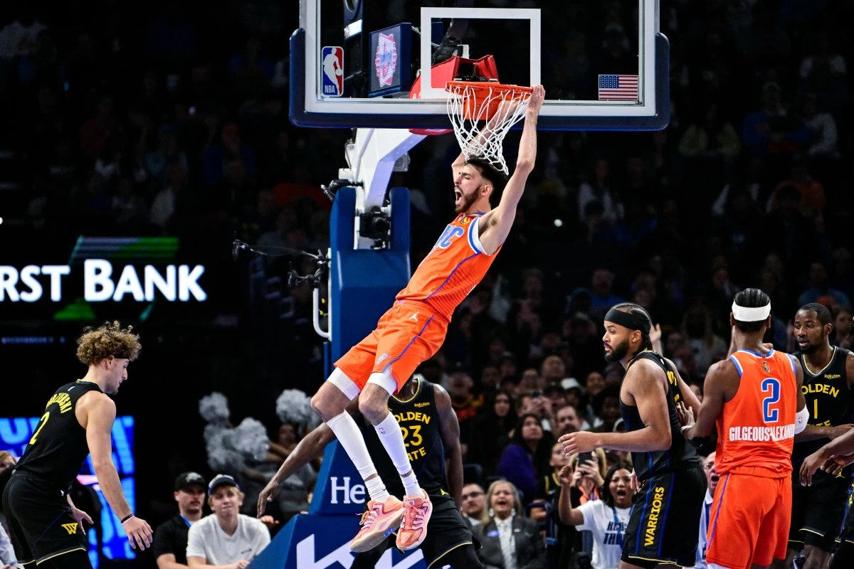Oklahoma City Thunder center/forward Chet Holmgren (7) celebrates after a dunk against the Golden State Warriors during the first half of an NBA basketball game, Tuesday, Nov. 11, 2025, in Oklahoma City. (AP Photo/Gerald Leong)